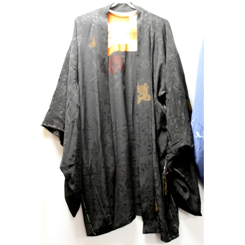 466 - Japanese black silk kimono jacket with woven floral and foliate decoration and a blue kimono decorat... 