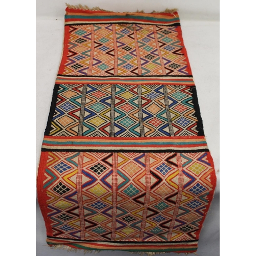 473 - Three Eastern woven floor mats, 120cm x 68cm, 110cm x 43cm and 52cm x 54cm.  (3).