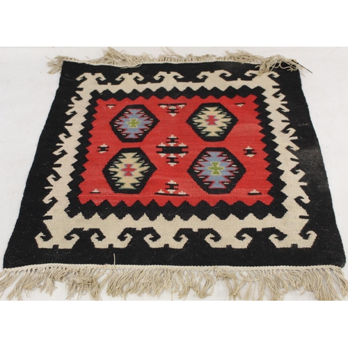 473 - Three Eastern woven floor mats, 120cm x 68cm, 110cm x 43cm and 52cm x 54cm.  (3).