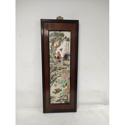 165 - Large framed Chinese porcelain plaque depicting a cockerel and other birds in flowers and foliage. W... 