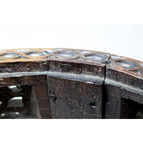 271 - Eastern pierced and carved hardwood footstool of oval form with four scroll feet and foliate decorat... 