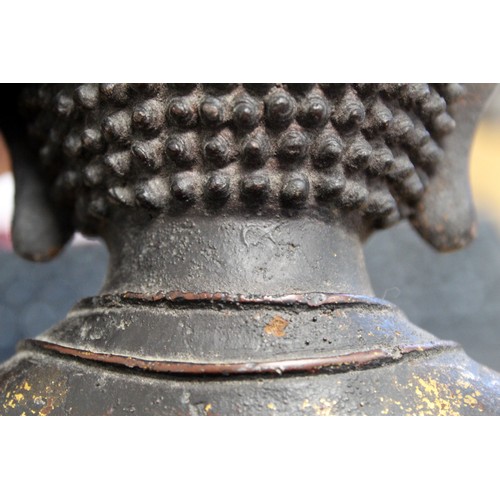 162 - Chinese bronze statue of the seated Buddha, traces of gilding, Qianling mark, 28cm high.