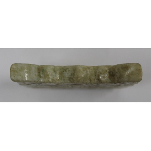 181 - Three Chinese archaic and archaised jade carvings to include a belt hook with dragon head carving, a... 