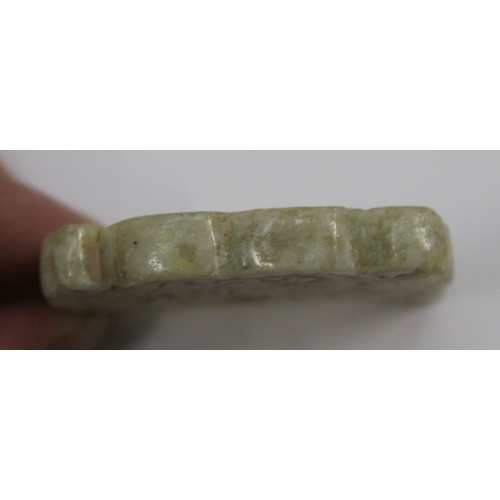 181 - Three Chinese archaic and archaised jade carvings to include a belt hook with dragon head carving, a... 