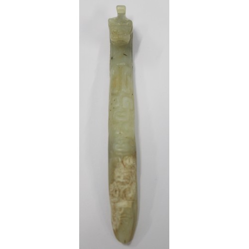 181 - Three Chinese archaic and archaised jade carvings to include a belt hook with dragon head carving, a... 