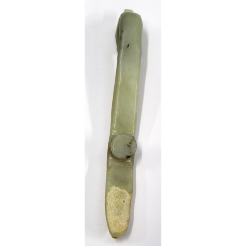 181 - Three Chinese archaic and archaised jade carvings to include a belt hook with dragon head carving, a... 