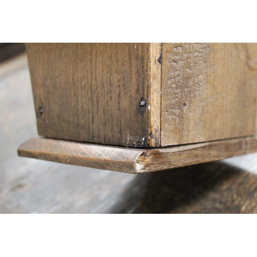 207 - Georgian oak hanging candle box of tapered rectangular form with fret cut pierced back and sliding l... 