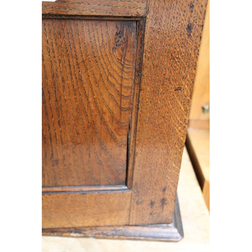 208 - Small Georgian oak hanging cupboard of rectangular form, the panelled door opening to reveal three s... 