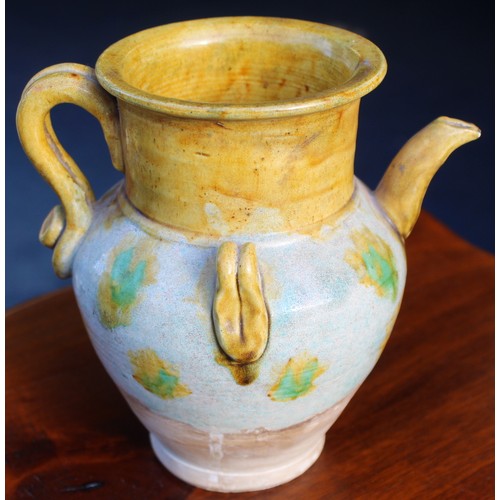 144 - Early Chinese, possibly Tang dynasty, pottery ewer, part yellow glazed, 18cm high and a brown glazed... 