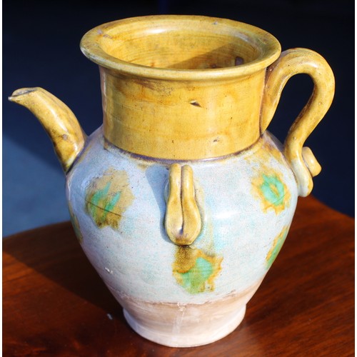 144 - Early Chinese, possibly Tang dynasty, pottery ewer, part yellow glazed, 18cm high and a brown glazed... 