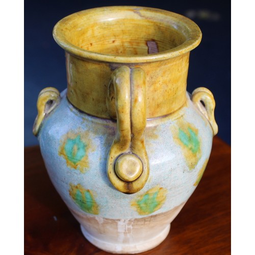 144 - Early Chinese, possibly Tang dynasty, pottery ewer, part yellow glazed, 18cm high and a brown glazed... 