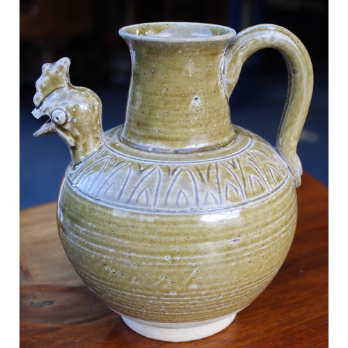 144 - Early Chinese, possibly Tang dynasty, pottery ewer, part yellow glazed, 18cm high and a brown glazed... 