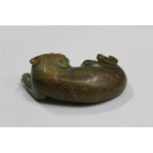 179 - Three Chinese archaic and archaised jade figures to include a repose cat figure, a rectangular toggl... 