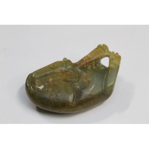 179 - Three Chinese archaic and archaised jade figures to include a repose cat figure, a rectangular toggl... 