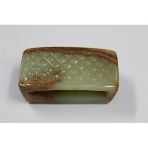 179 - Three Chinese archaic and archaised jade figures to include a repose cat figure, a rectangular toggl... 