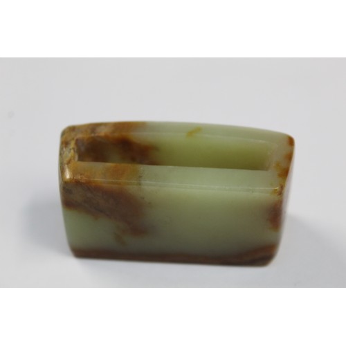 179 - Three Chinese archaic and archaised jade figures to include a repose cat figure, a rectangular toggl... 