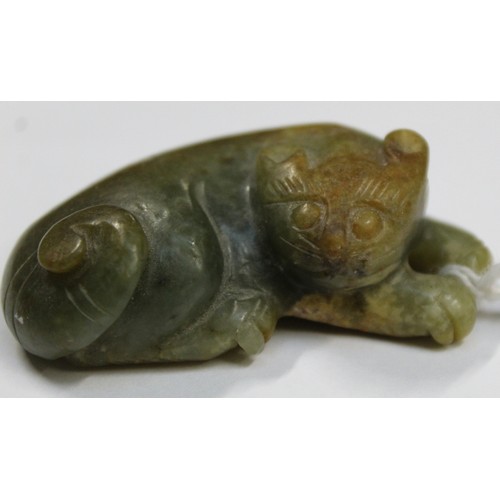 179 - Three Chinese archaic and archaised jade figures to include a repose cat figure, a rectangular toggl... 