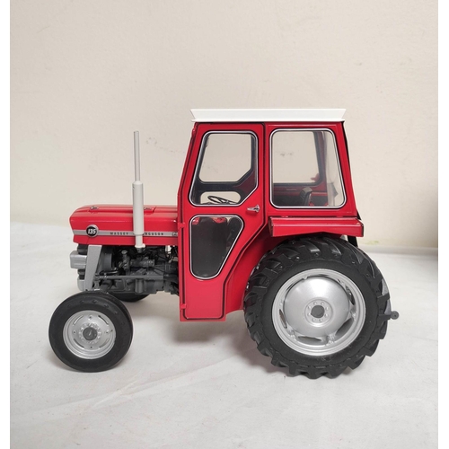 67 - Universal Hobbies boxed 1:16 scale model 1965 Massey Ferguson 135 tractor with cabin. UH2697