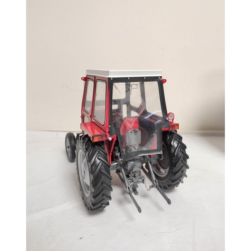 67 - Universal Hobbies boxed 1:16 scale model 1965 Massey Ferguson 135 tractor with cabin. UH2697