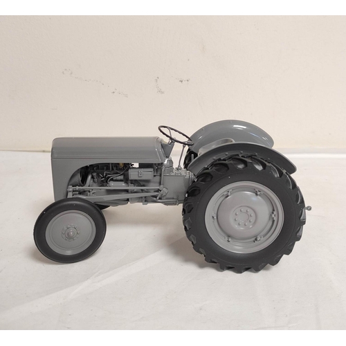 69 - Three Universal Hobbies boxed model tractors to include a 1:16 scale Ferguson TEA 20 tractor UH2690,... 