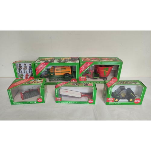 63 - Quantity of Siku 1:32 scale boxed agricultural implements  to include a fodder mixing wagon 245... 