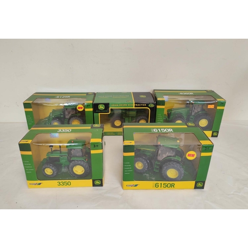 64 - Five boxed Britains John Deere model tractors to include a 1:32 scale 8440 tractor 42471, a 1:32 sca... 