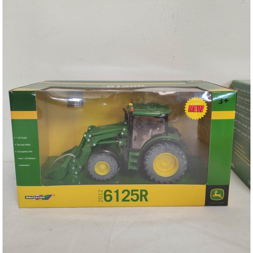 64 - Five boxed Britains John Deere model tractors to include a 1:32 scale 8440 tractor 42471, a 1:32 sca... 