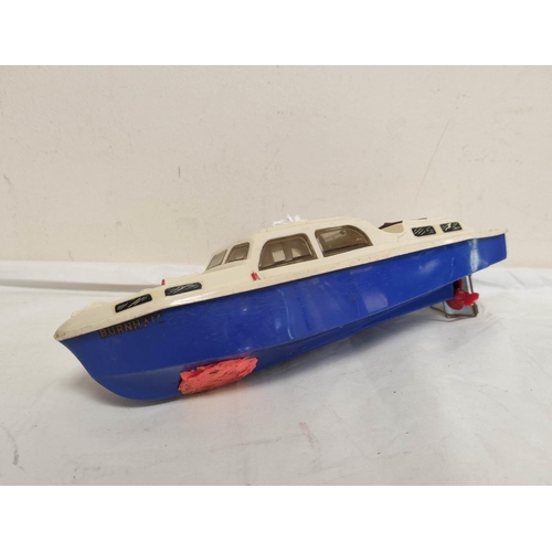 29 - Vintage 1950s clockwork and friction powered toys to include a Tri-ang Burnham model boat in plastic... 