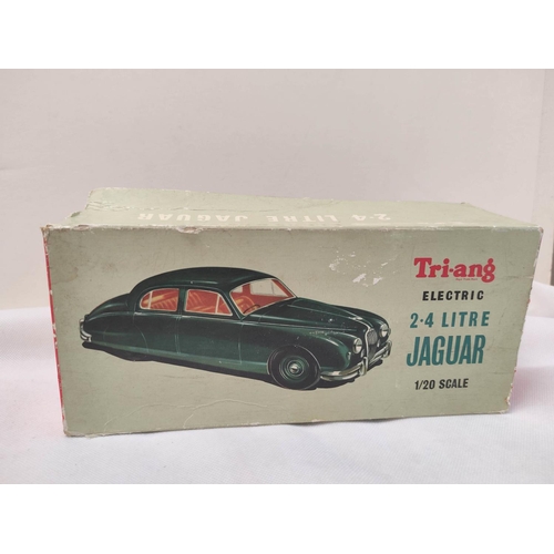 22 - Tri-ang 1/20 scale Electric 2.4 Litre Jaguar in sky blue paint. Original box present but bashed and ... 