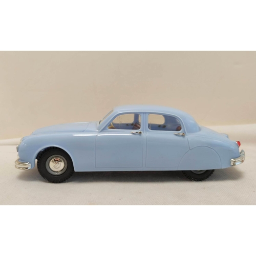 22 - Tri-ang 1/20 scale Electric 2.4 Litre Jaguar in sky blue paint. Original box present but bashed and ... 