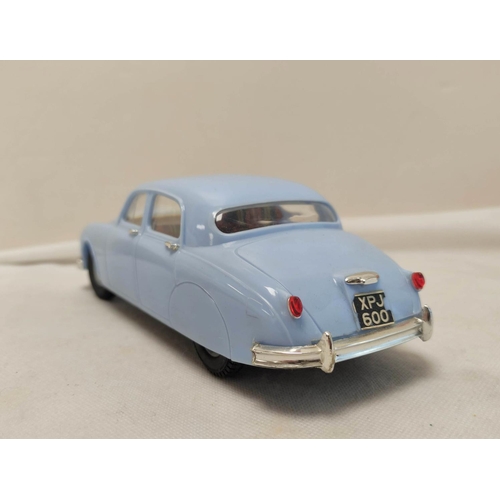 22 - Tri-ang 1/20 scale Electric 2.4 Litre Jaguar in sky blue paint. Original box present but bashed and ... 