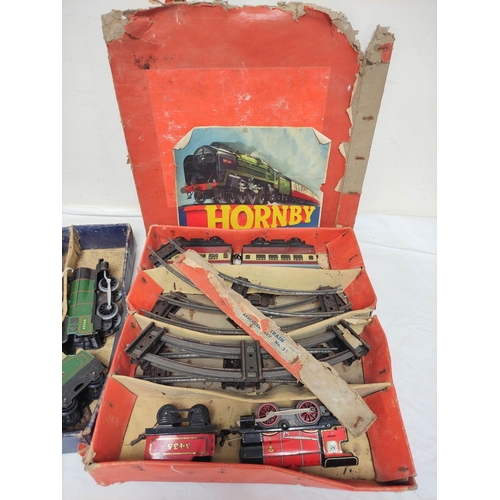 2 - Two vintage clockwork Hornby 0 gauge passenger sets to include a No31, box present but heavily damag... 