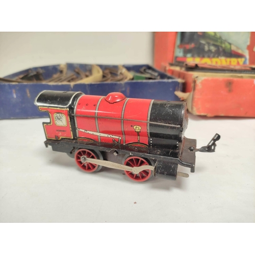 2 - Two vintage clockwork Hornby 0 gauge passenger sets to include a No31, box present but heavily damag... 