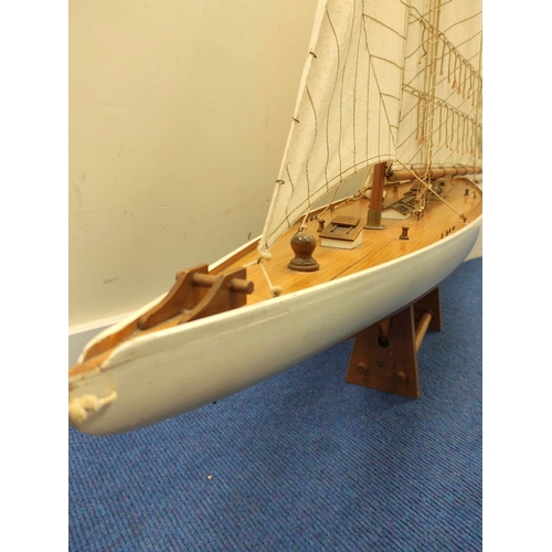 55 - Large model sailing ship by Nauticalia of London with wooden hull and canvas sails.