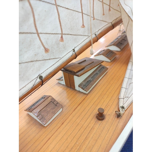 55 - Large model sailing ship by Nauticalia of London with wooden hull and canvas sails.