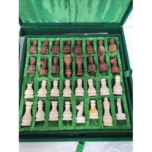 60 - Hardstone chess set in plush green velvet case