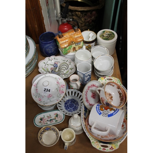 234 - Ceramics to include mugs, dishes, trinkets, a Victorian moustache cup, etc.