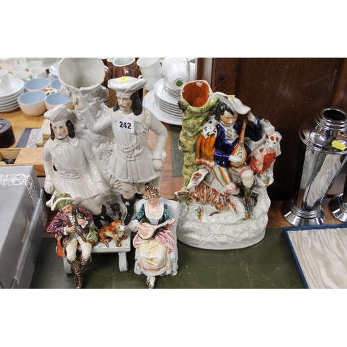 242 - Two Staffordshire flat-back models and two models depicting figures in Victorian dress.