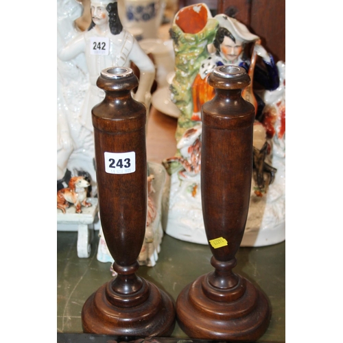 243 - Pair of turned oak candlestick bases.