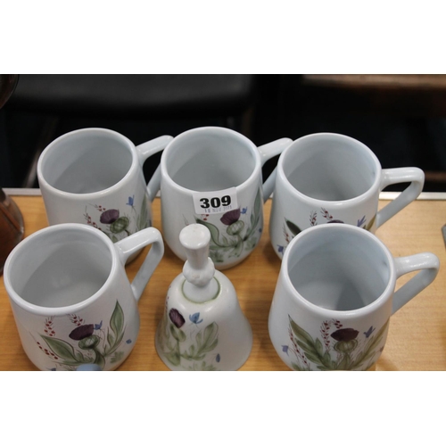 309 - Five Buchan thistle decorated mugs and a hand-bell.