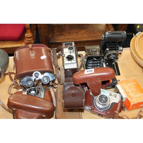 320 - Cameras to include Agfa, Zeiss Ikon, Bell & Howell 8mm cine camera, Prunier & Fils binocular... 