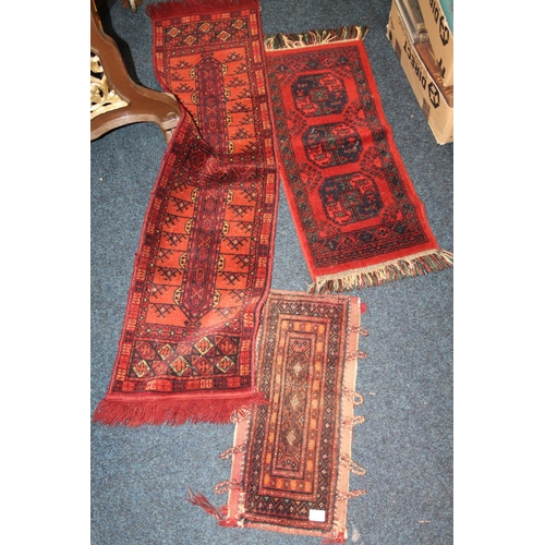 850 - Three Persian red ground small rugs/prayer mats.