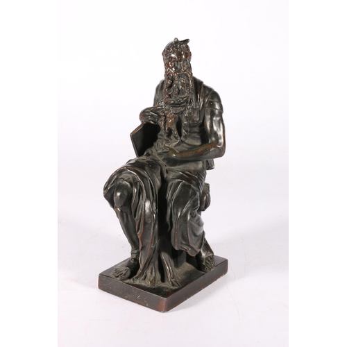 106 - Cast metal statue, possibly a representation of the devil, 26cm tall.