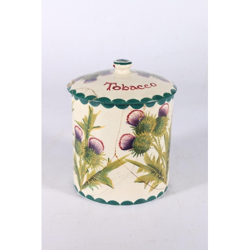 131 - Wemyss Pottery thistle pattern tobacco jar and cover, 16cm tall.