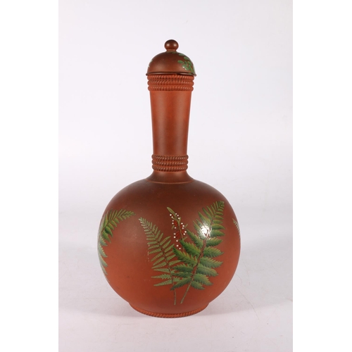 135 - Terracotta pottery bottle vase decorated with botanical sprays in the manner of Watcombe, 29cm tall.