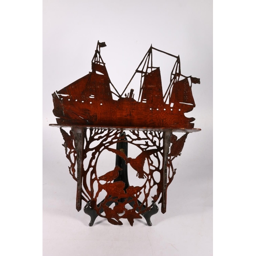 163 - Fret carved mahogany wall shelf decorated with galleon top and birds below, 45cm tall.