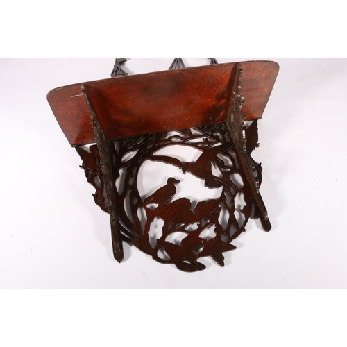 163 - Fret carved mahogany wall shelf decorated with galleon top and birds below, 45cm tall.