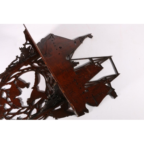 163 - Fret carved mahogany wall shelf decorated with galleon top and birds below, 45cm tall.