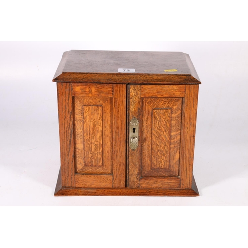 72 - Oak two-door smoker's cabinet, 26cm wide.