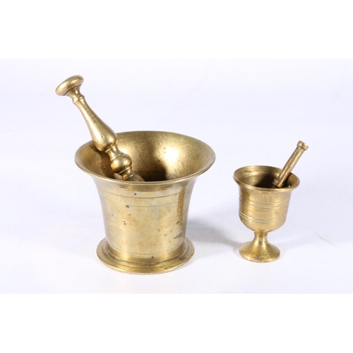 98 - Bronze pestle and mortar, 10cm tall, and another, 7.5cm tall.  (2)